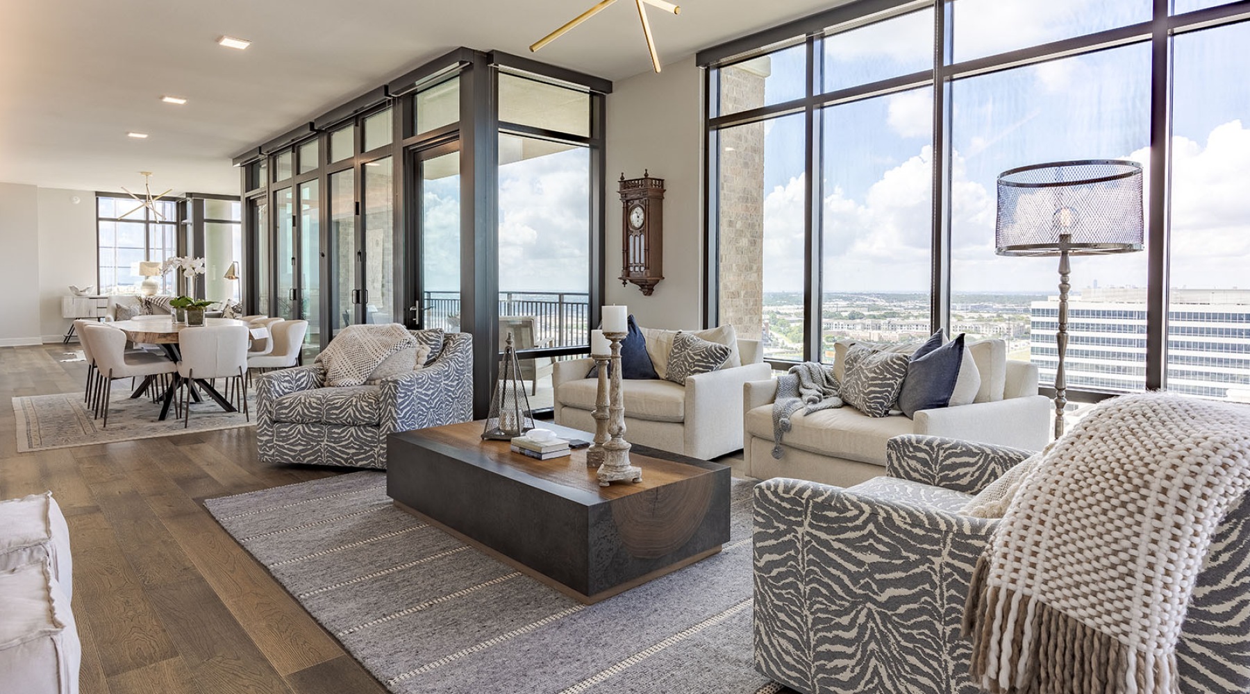 a living room with floor-to-ceiling windows