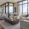 a living room with floor-to-ceiling windows