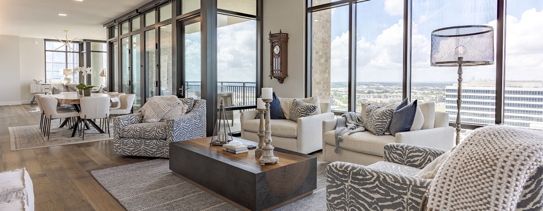 a living room with floor-to-ceiling windows